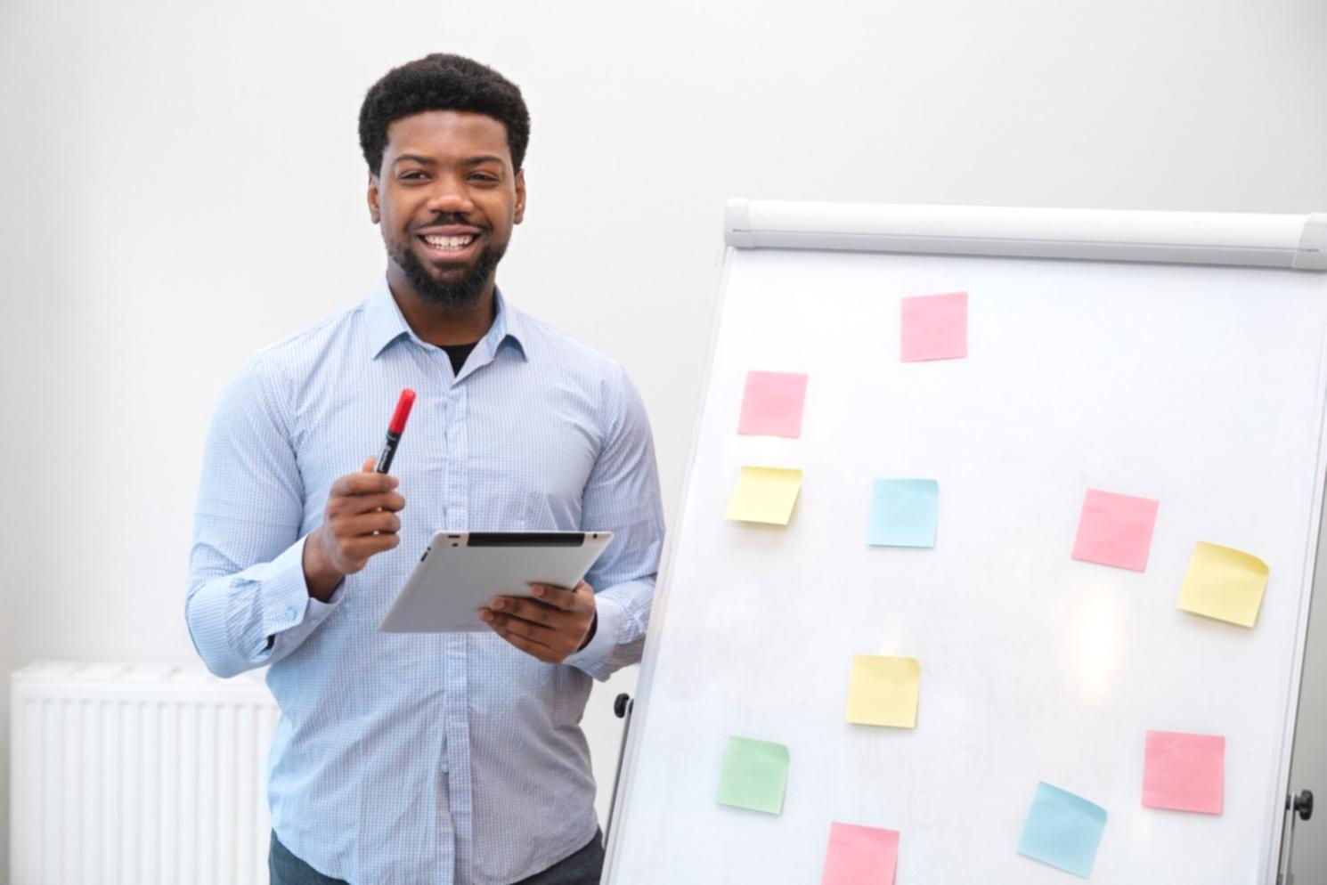 Professional cost management training session with participants analyzing financial data and optimization strategies